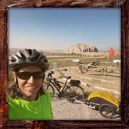 Photo, Day 18 of the TransAmerica Bicycle Trail, Mandy in front of Beaverhead Rock between Dillon and Twin Bridges Montana