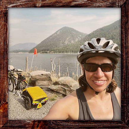 Photo, Day 20 of the TransAmerica Bicycle Trail, Mandy in front of Hebgen Lake near West Yellowstone, Montana