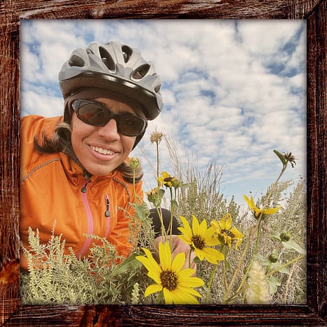 Photo, Day 38 of the TransAmerica Bicycle Trail, Mandy with Black-Eyed Susan flowers