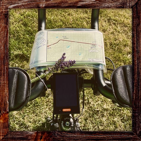Photo, Day 35 of the TransAmerica Bicycle Trail, Bicycle handlebars with a map and bouquet of lavender