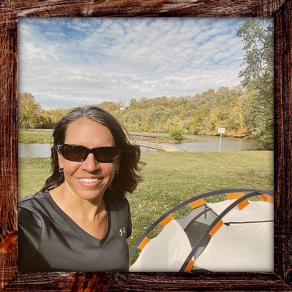 Photo, Day 43 of the TransAmerica Bicycle Trail, Mandy with her tent in front of the Gasconade River and Casador Lake